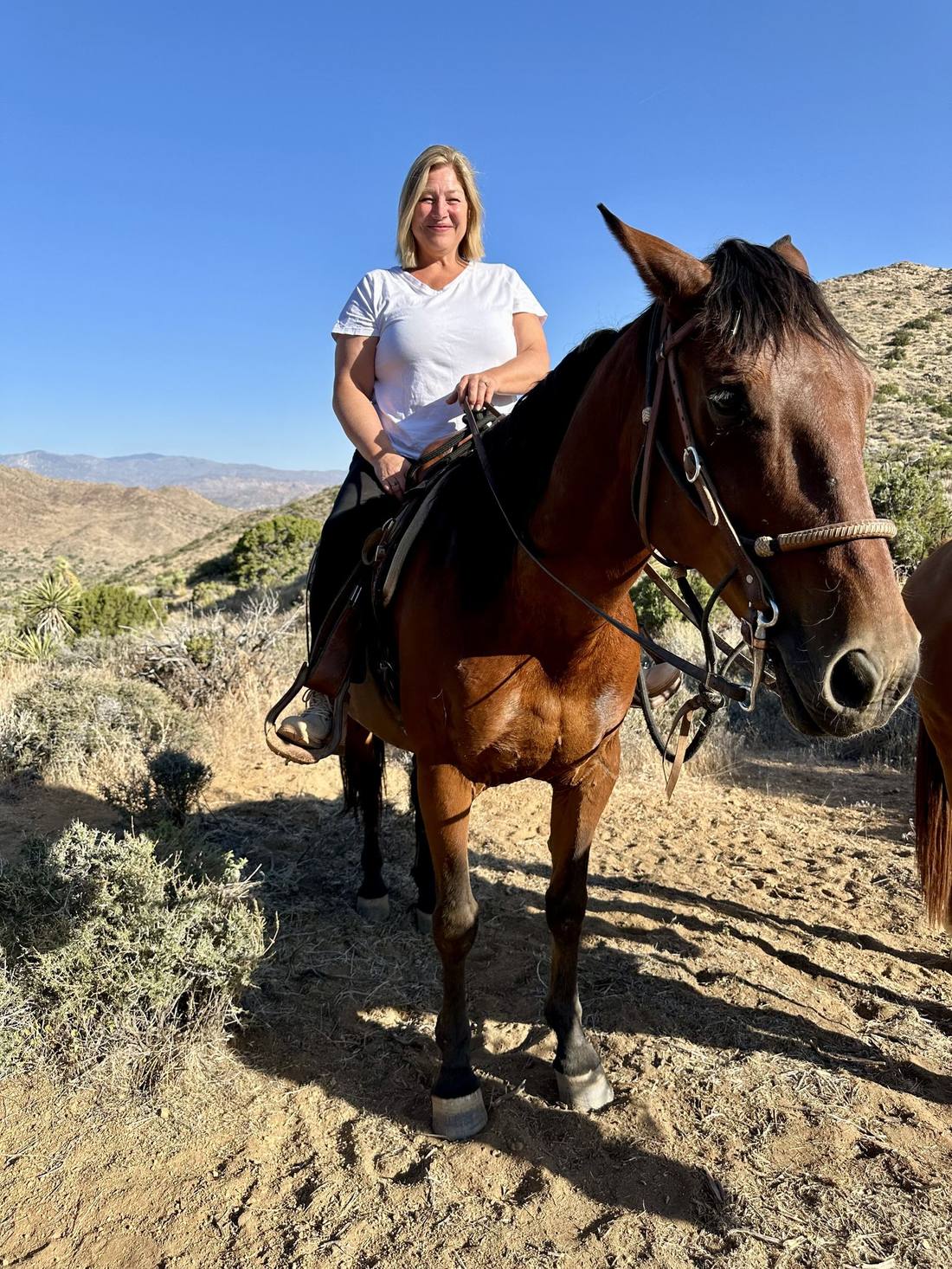 My mother on horseback in Joshua Tree, grinning