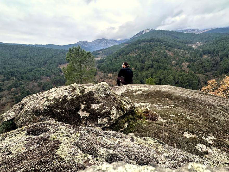 Sitting on a granite outcrop above the pines, Sierra de Gredos, Spain