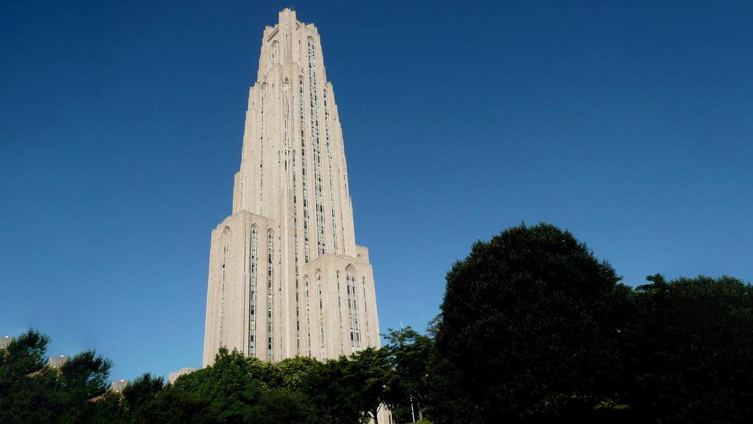 The Cathedral of Learning rising over the trees at Pitt